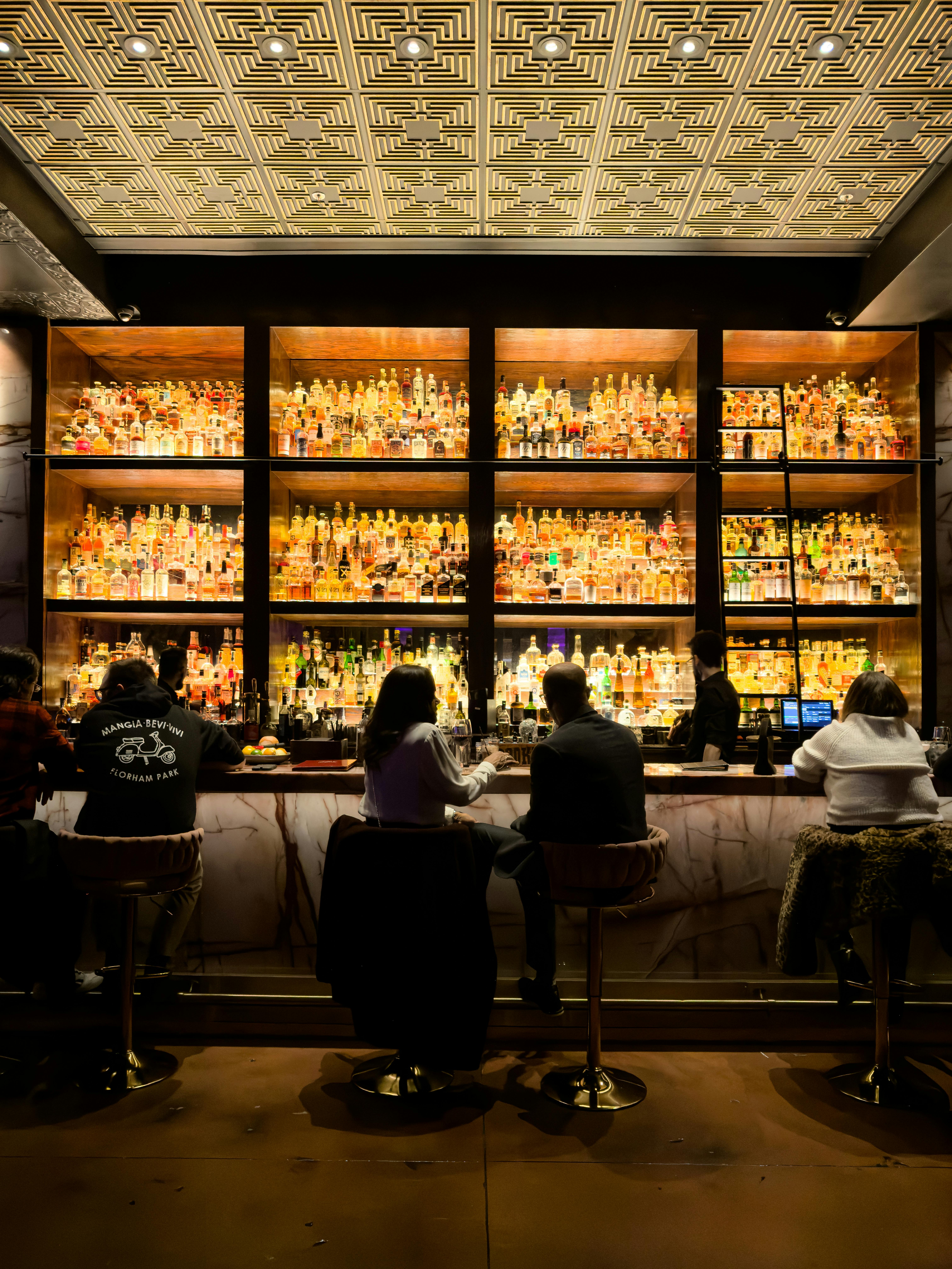 A group of soccer players celebrating a goal on the field.