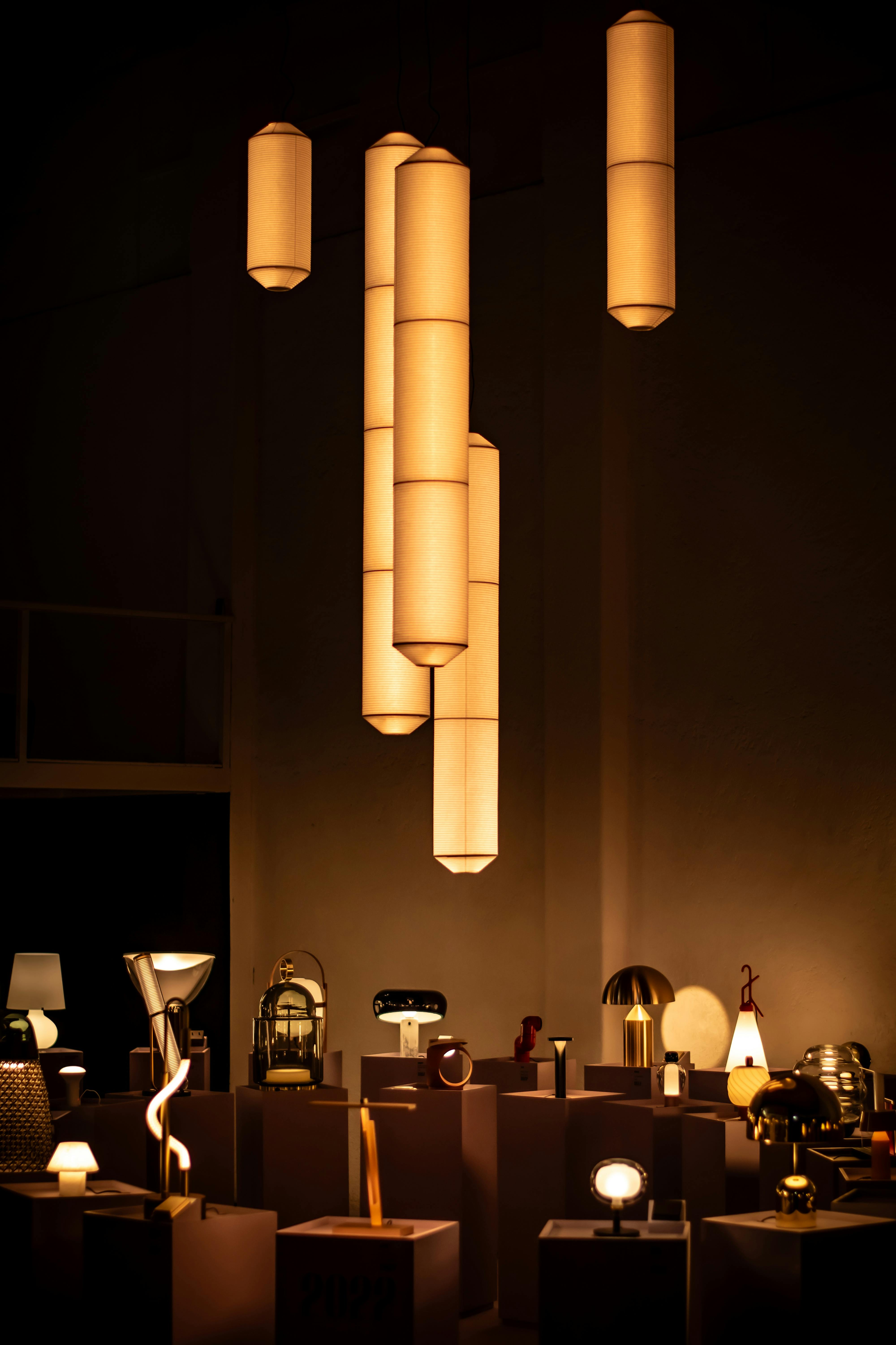 Stylish indoor lighting arrangement with pendant lights in a showroom.