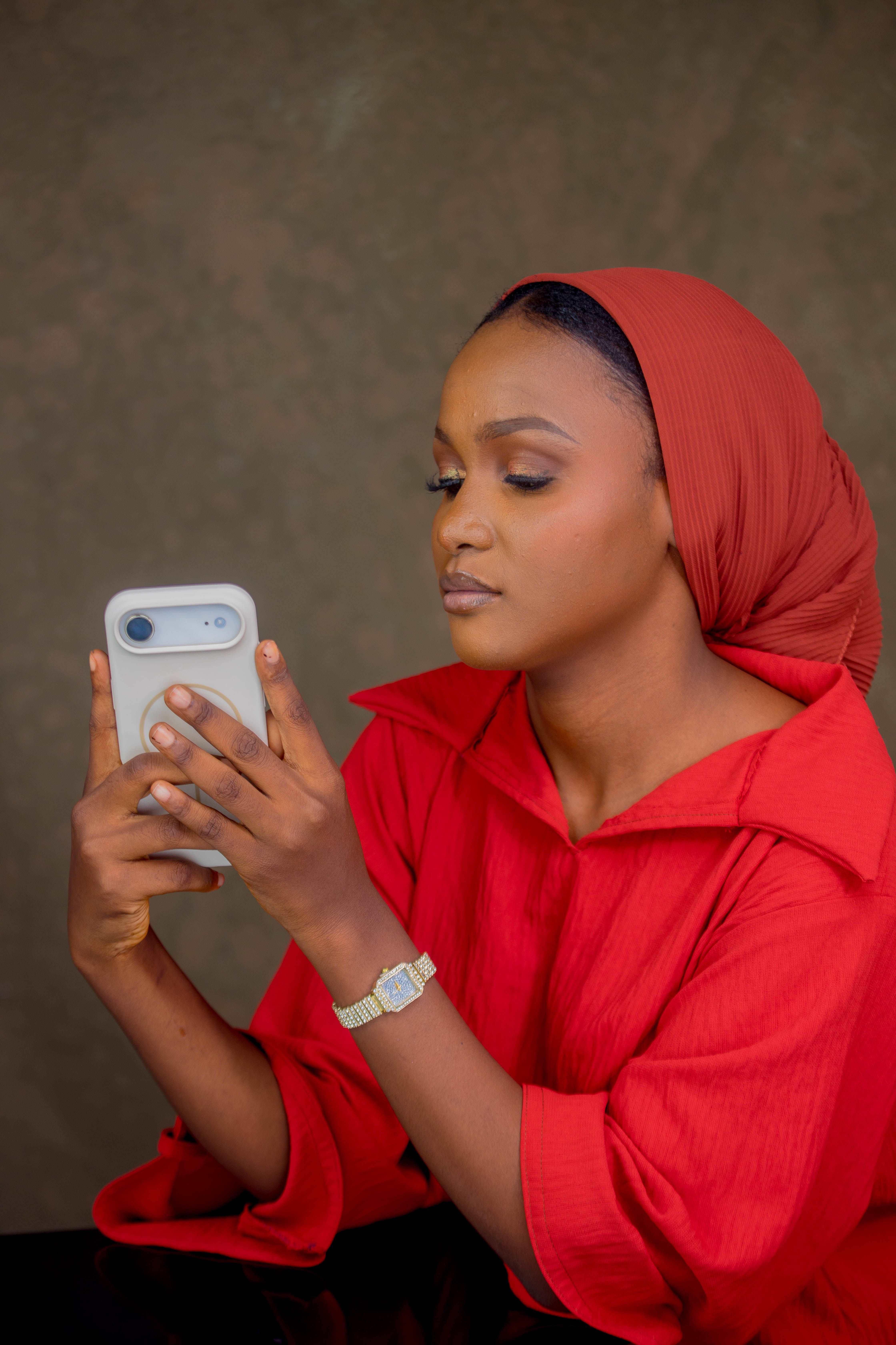 Woman in Red Hijab Using Smartphone · Free Stock Photo