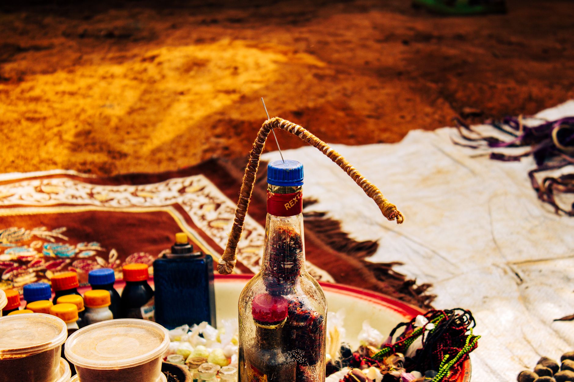 Close-up of traditional items and a bottle at a market in Ngel Nyaki, Nigeria.