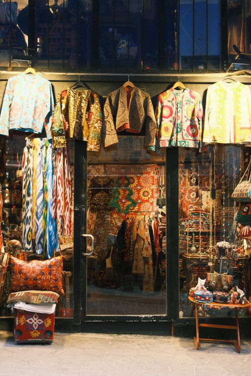 Free Colorful textiles and garments displayed outside a shop in Istanbul's Grand Bazaar. Stock Photo