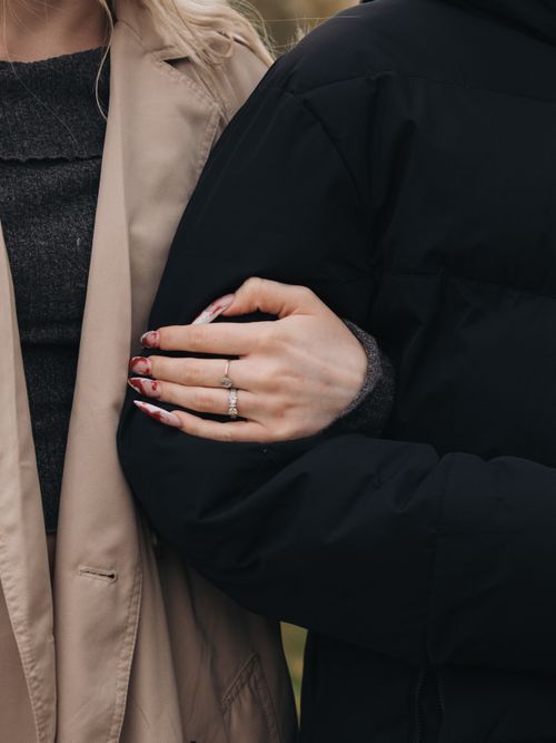 Free Tender moment of couple holding arms, showcasing elegance and intimacy. Stock Photo