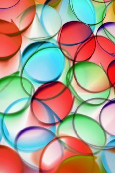 Vibrant abstract art featuring overlapping translucent circles in red, blue, and green tones.