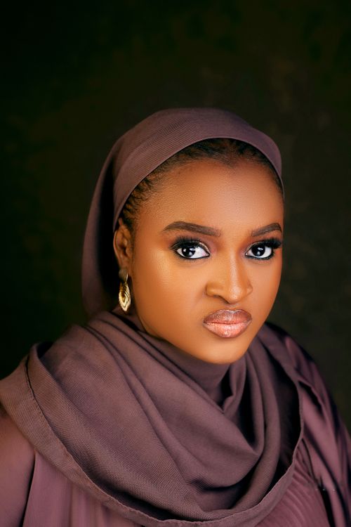 Free Elegant portrait of a woman wearing a hijab and earrings, exuding beauty and confidence. Stock Photo
