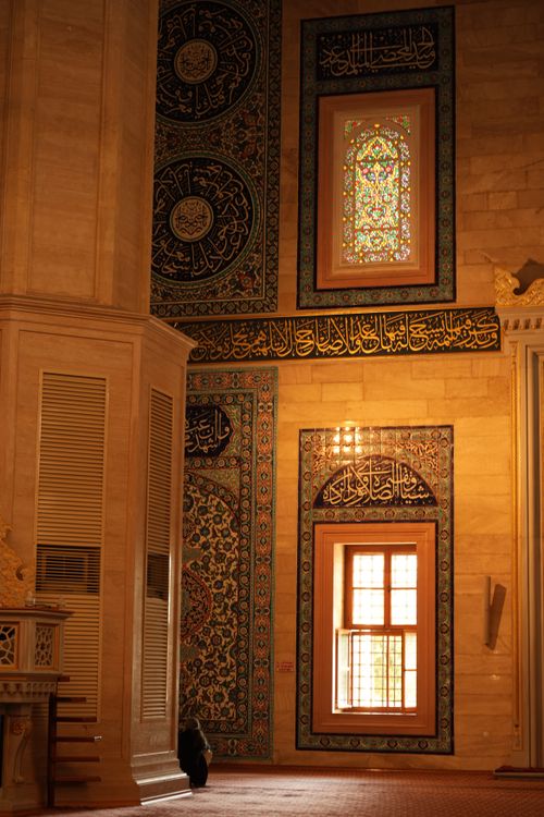 Free Beautiful mosque interior with colorful stained glass and Islamic calligraphy. Stock Photo