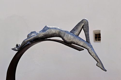 Free Stunning modern sculpture depicting a reclining figure in Armação de Pêra, Portugal. Stock Photo