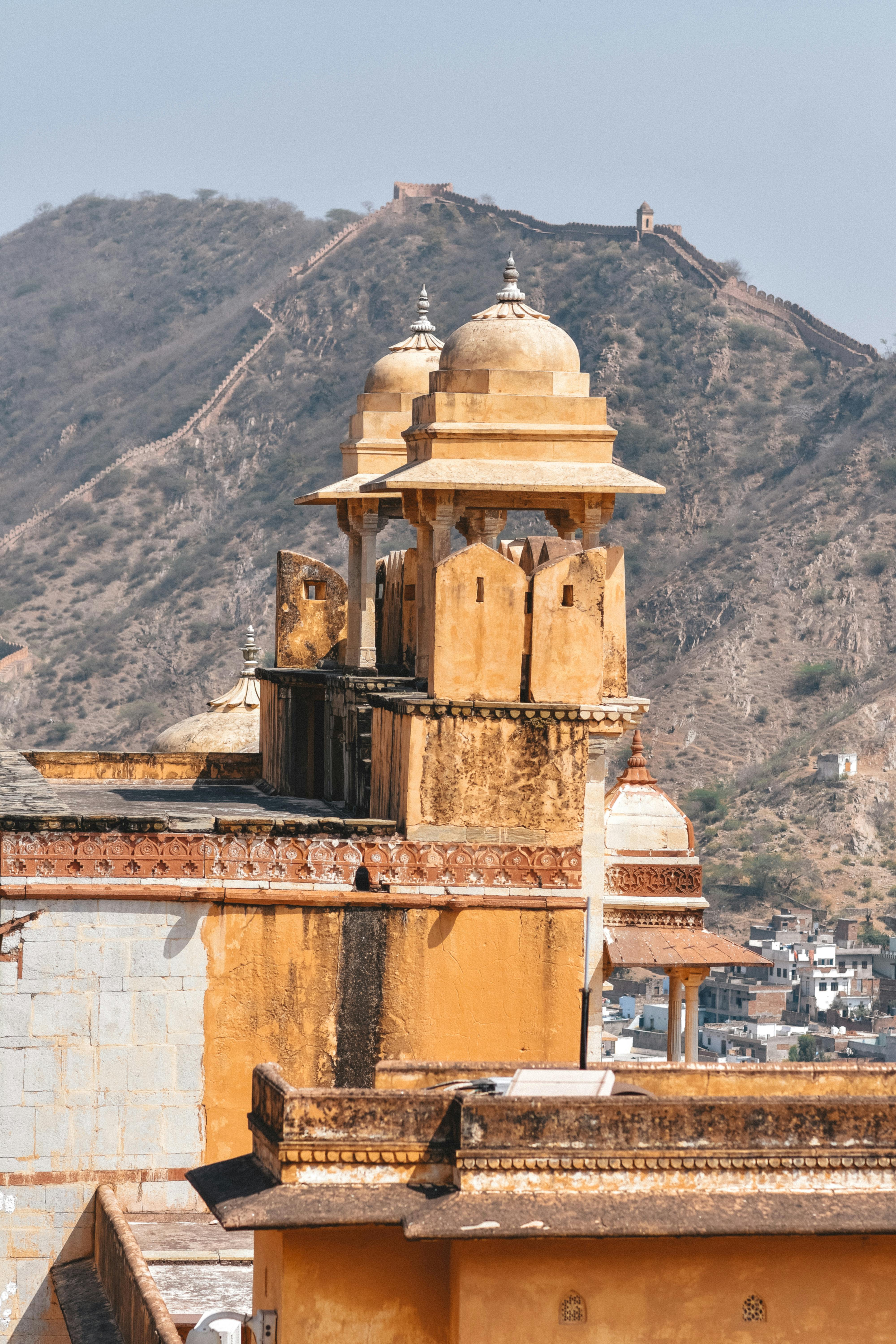 Majestic view of Amber Fort's architecture set against the rugged hills of Jaipur, India.