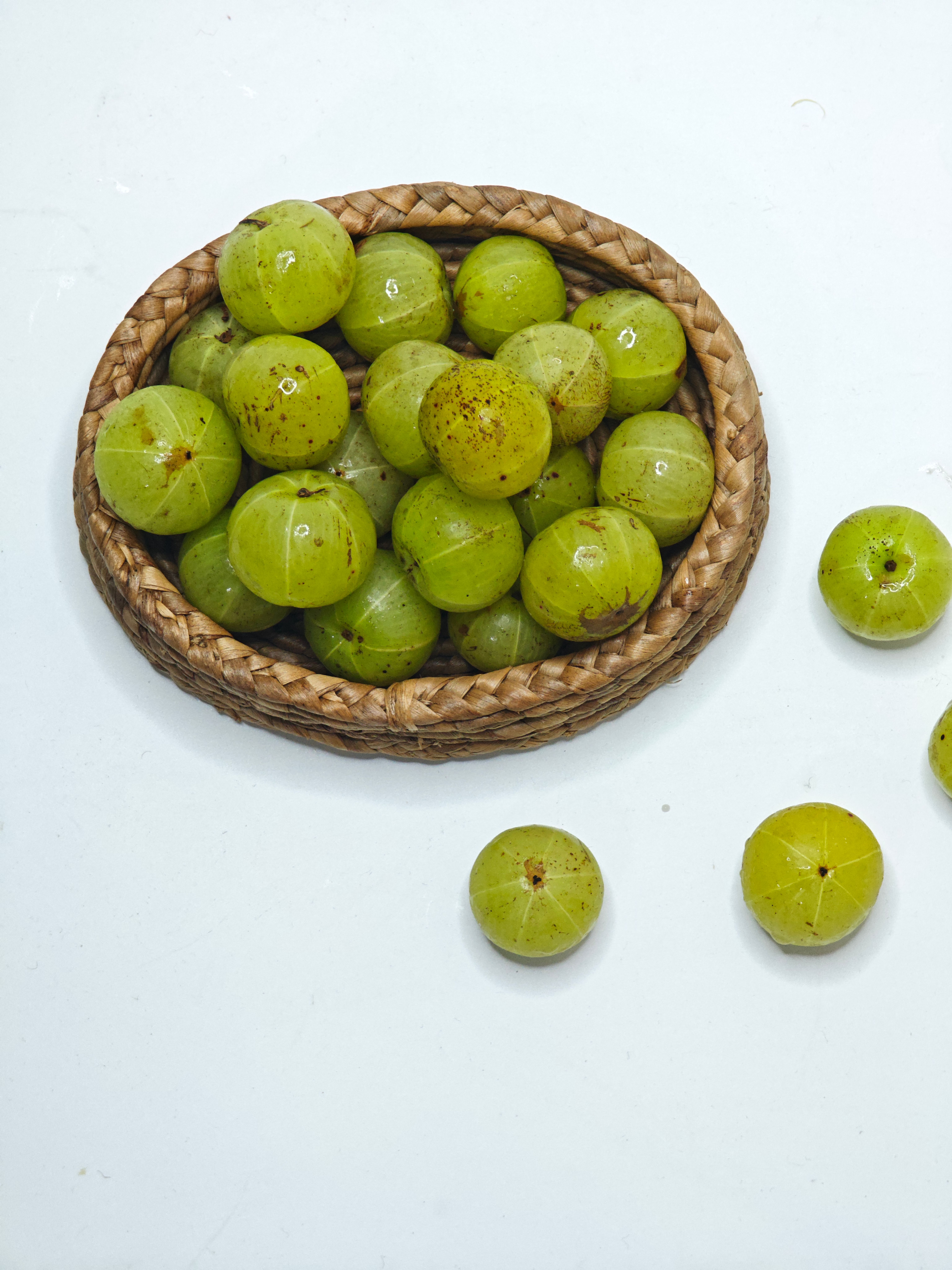 Fresh Indian Gooseberries in Wicker Basket · Free Stock Photo