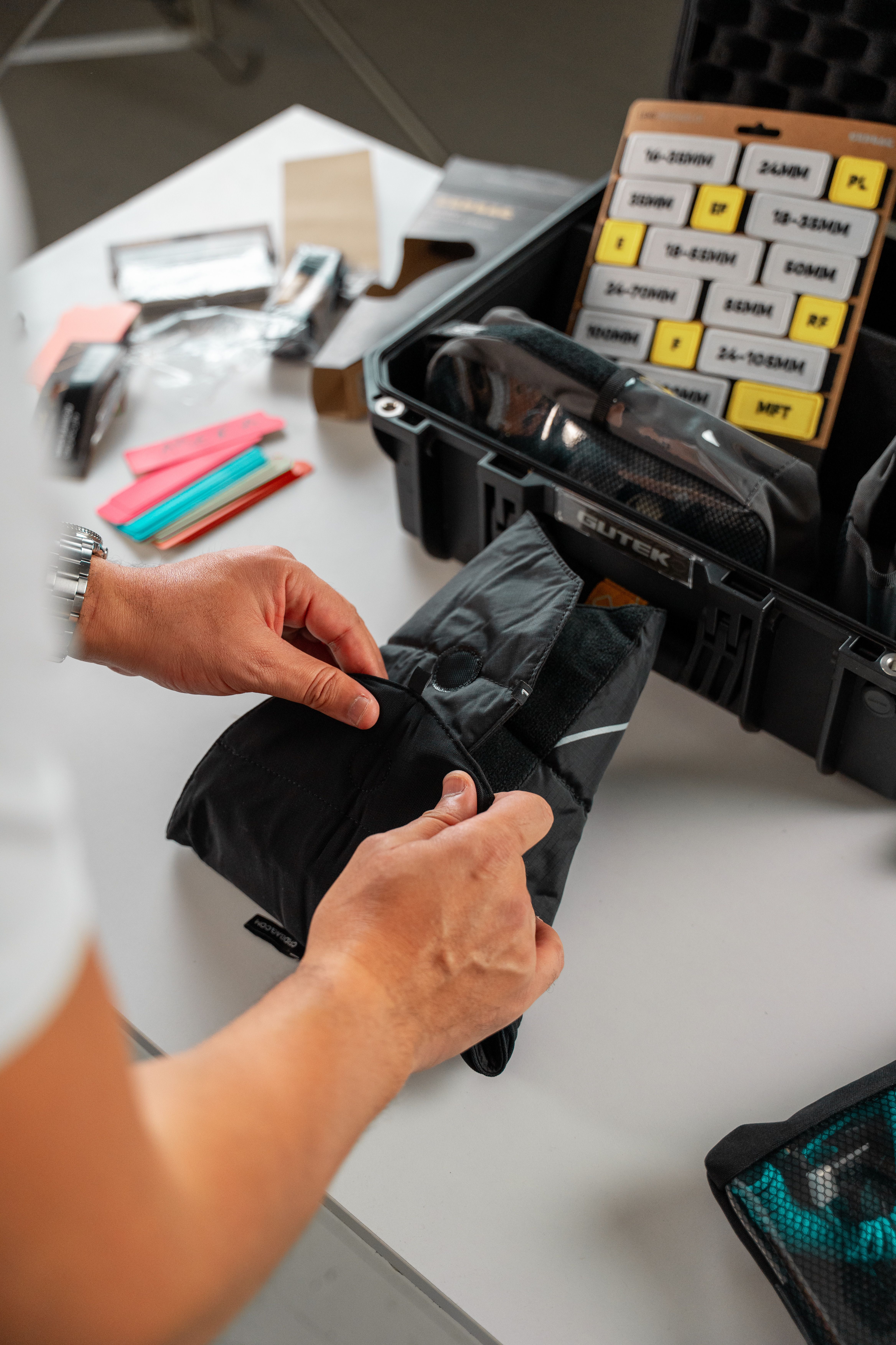 Person Preparing Camera Equipment for Photo Shoot · Free Stock Photo
