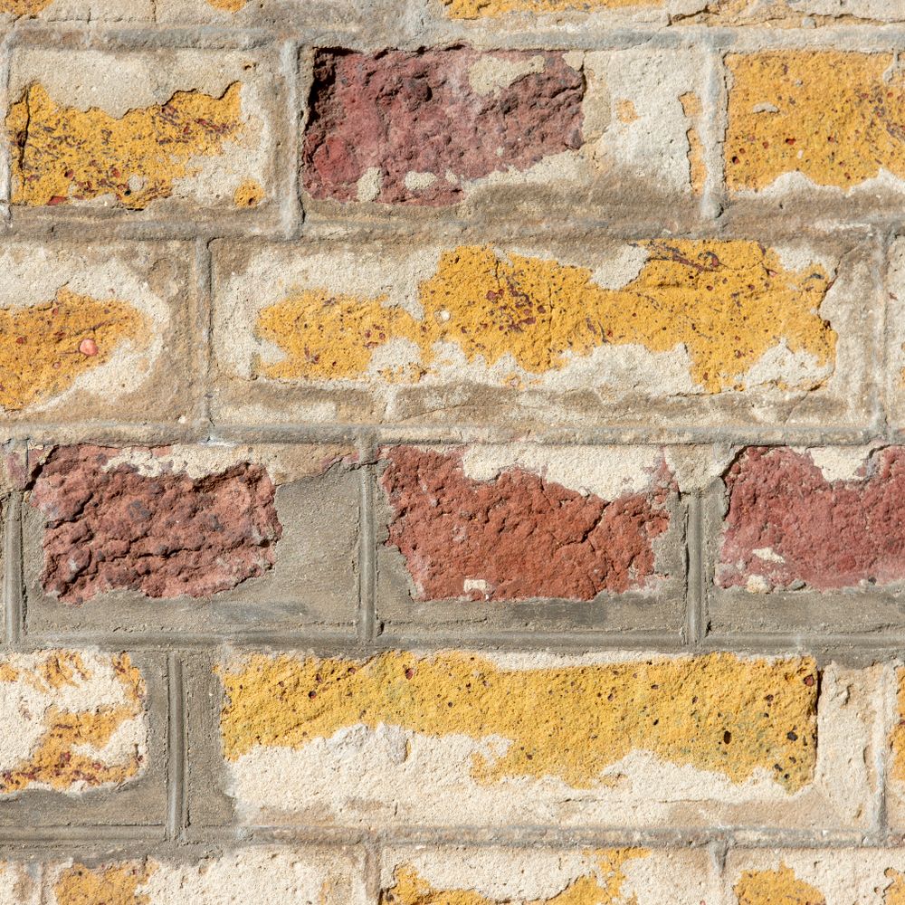 Masonry and Render Painting in Cudham — a decorator at work mid-project