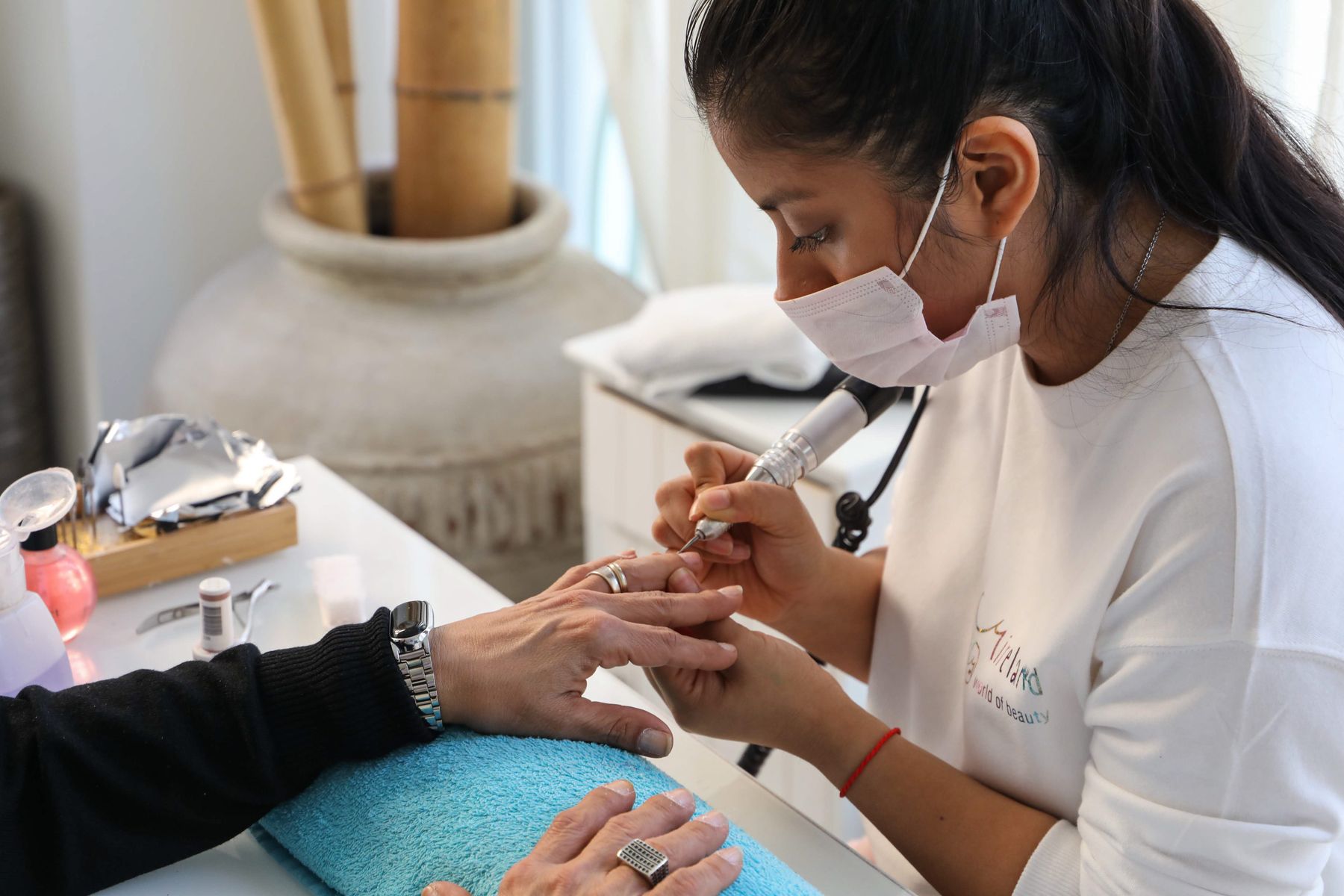 Precision manicure service with nail care tools and polish