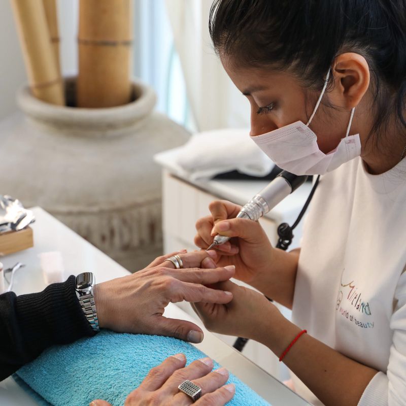 Manicure being finished at Nail Studio