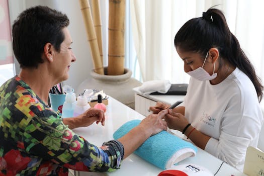 Woman enjoying a relaxing manicure in a peaceful salon setting.