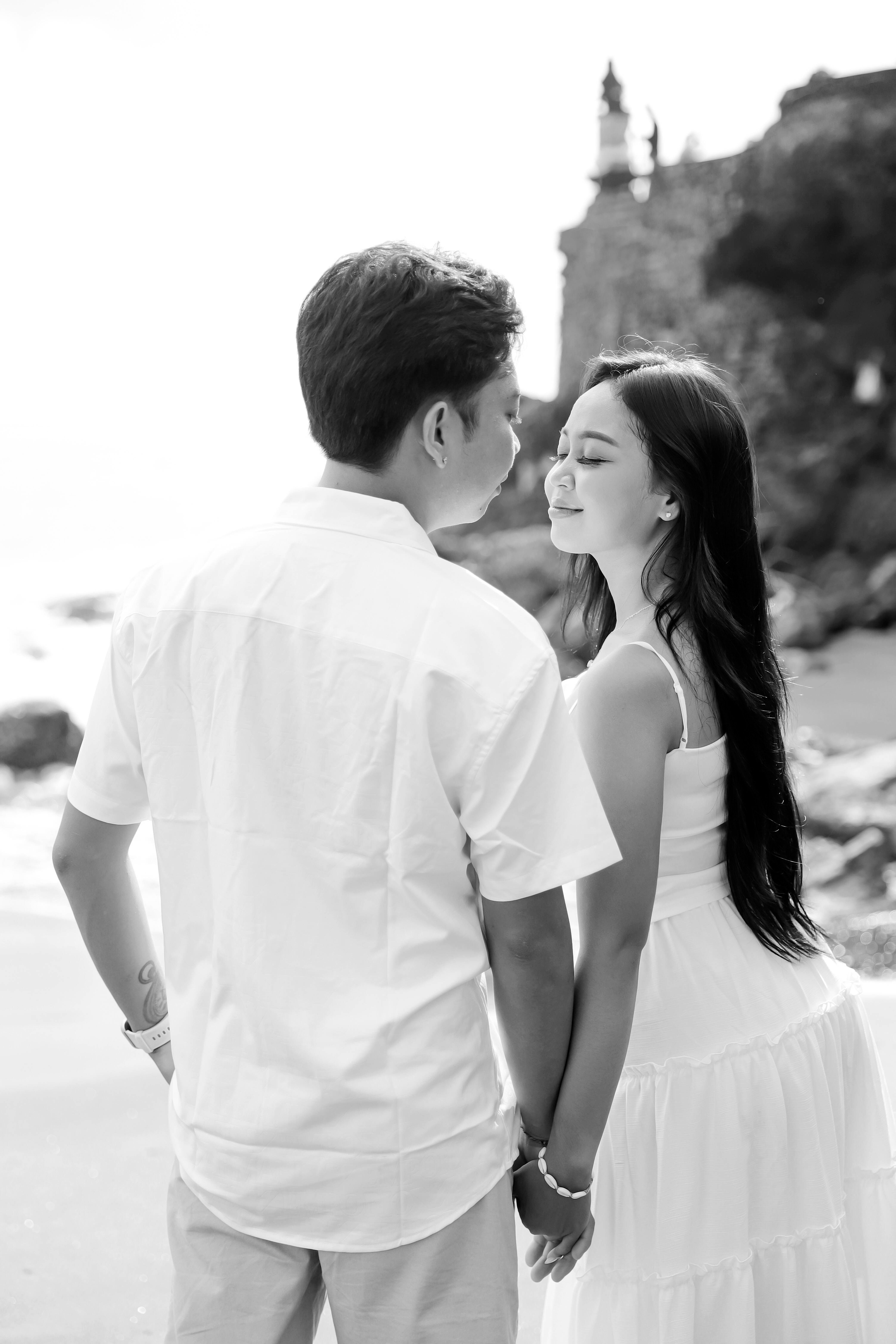 Romantic Couple Holding Hands on Beach · Free Stock Photo
