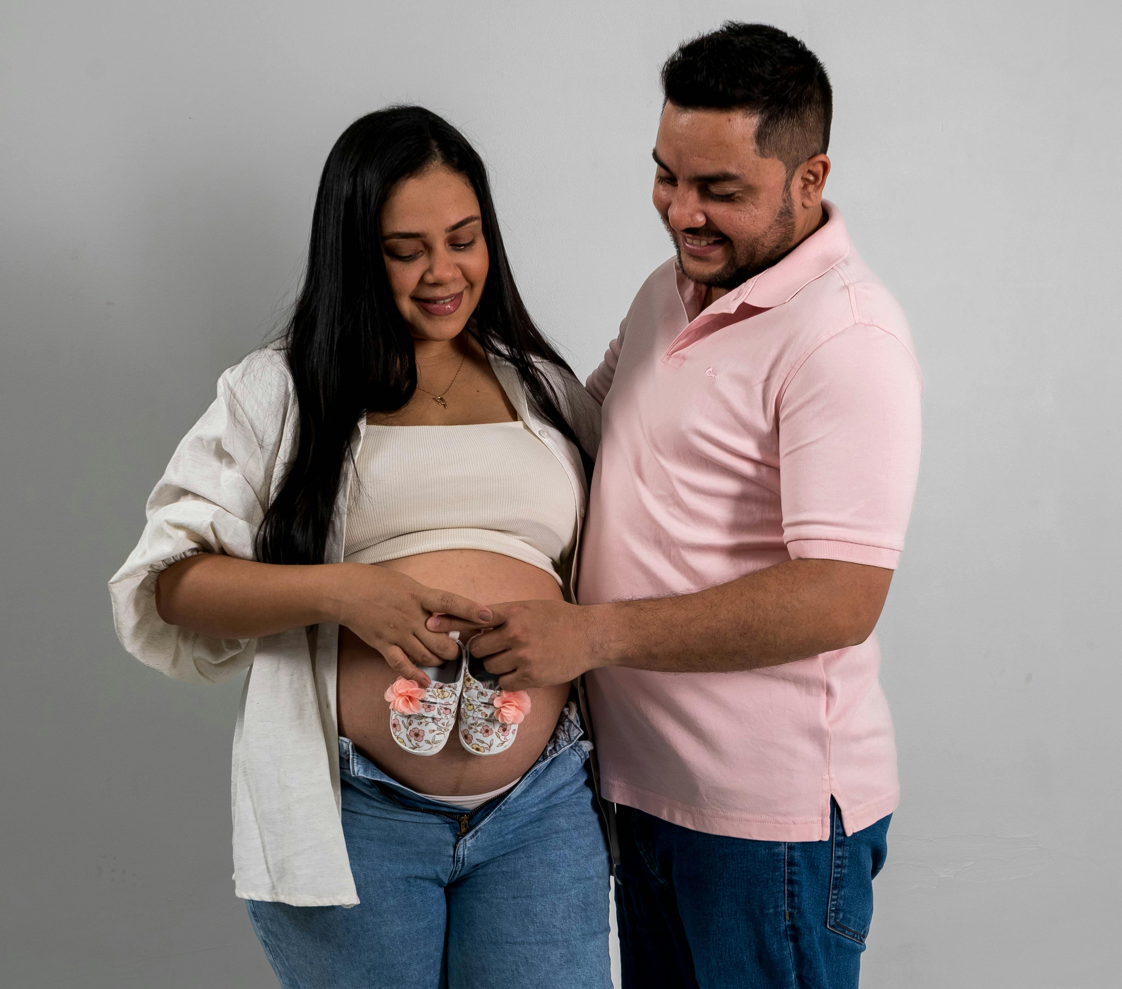 A stylized graphic of a celebrity&#039;s silhouette with a baby bump composed of marketing charts and dollar signs, representing the business of a celebrity pregnancy.