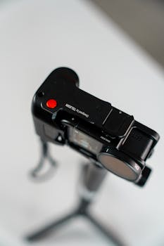 Close-up of a modern action camera on a tripod. Innovative tech accessory.