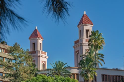 Free Twin architectural towers in Valencia with palm trees on a sunny day. Stock Photo