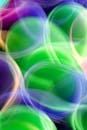 Vibrant Abstract Light Art in Green and Purple