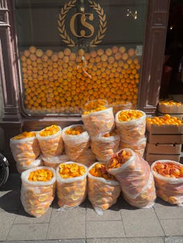 Bags of oranges and orange peels outside a shop in Stockholm, Sweden.