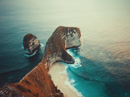 Scenic Photo of Rock Formation on Sea