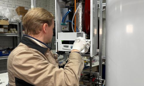 Technician repairing a heating system