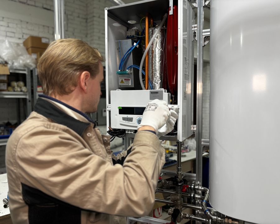 Technician servicing a heating appliance