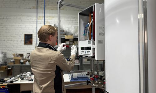 Technician inspecting a heating system