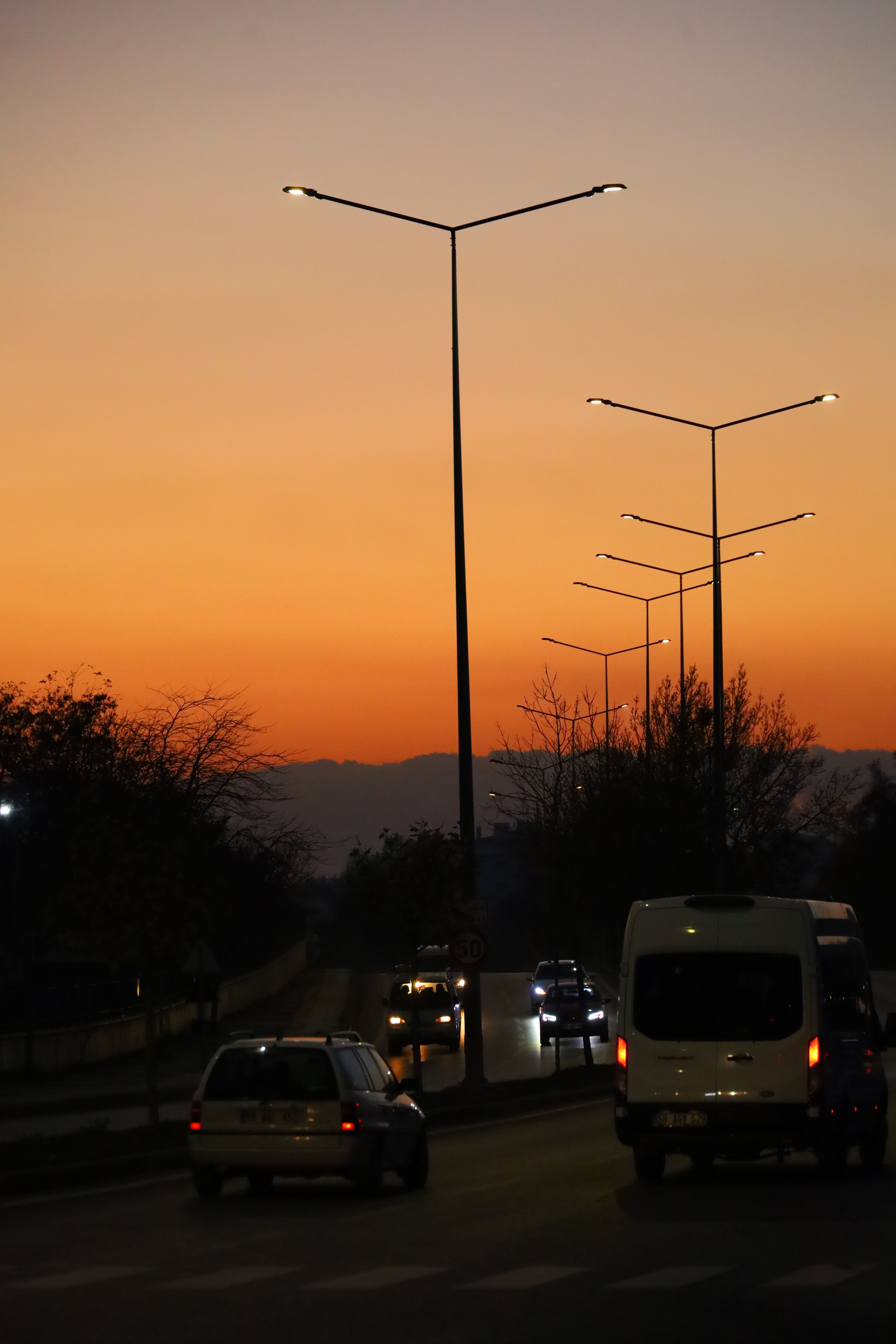 City Street at Dusk with Streetlights and Cars · Free Stock Photo