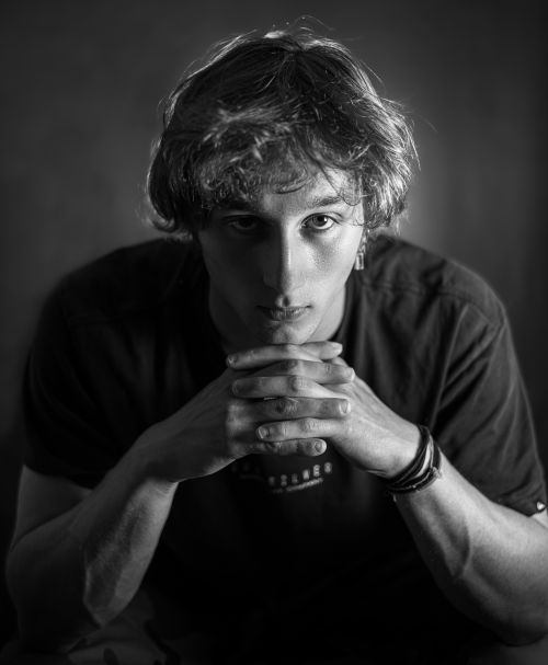 Free Artistic black and white portrait of a contemplative man in Paris. Stock Photo