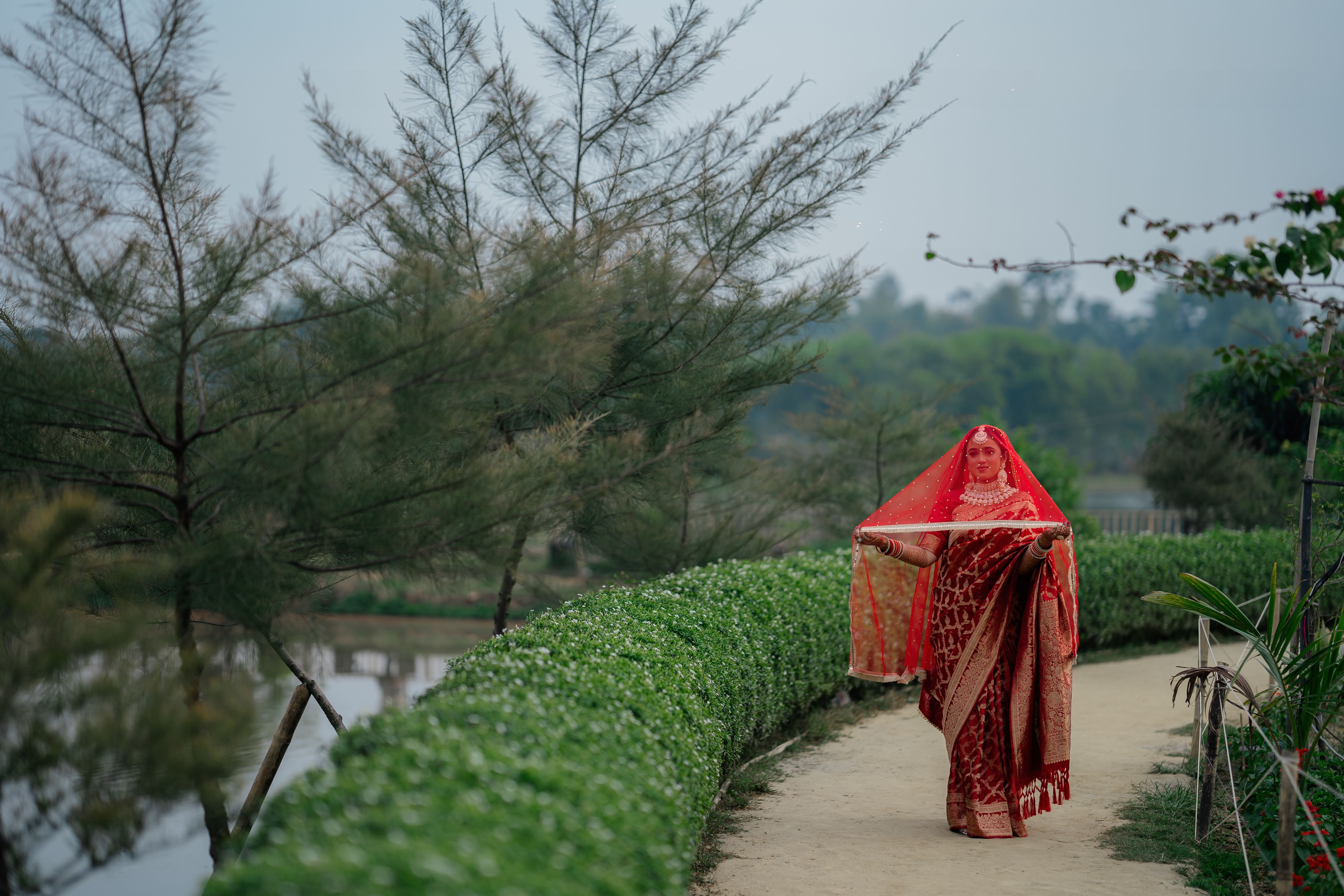 Traditional attire in scenic outdoor pathway · Free Stock Photo
