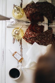 A cozy flatlay of artisan skincare and warm tones perfect for self-care routines.