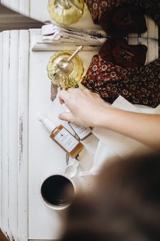 Aesthetic flatlay of natural skincare products and coffee for a serene morning routine.