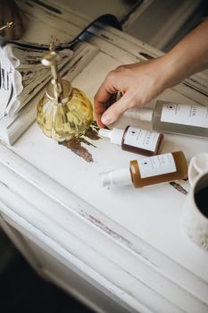 A cozy flatlay of artisan skincare bottles on a rustic vanity, promoting natural beauty.