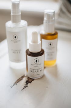 A minimalist display of natural skincare products with soft light and warm tones.