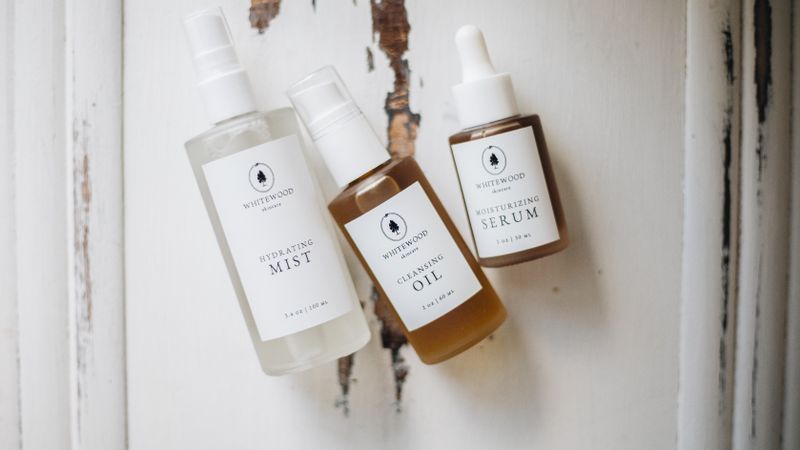 Minimalist vegan skincare products in a flat lay arrangement