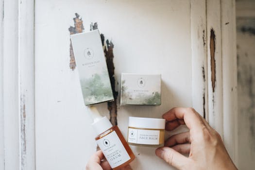 High-angle view of natural skincare products featuring face serum and balm with eco-friendly packaging.