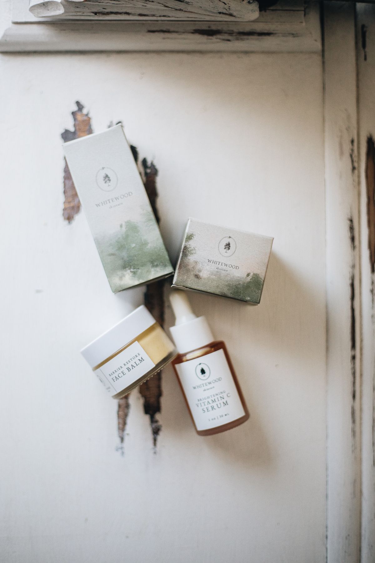 Minimalist flat lay of unbranded skincare bottles — generic stock, still a placeholder pending real/licensed product photography