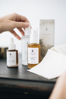Elegant still life of luxury skincare products with natural ingredients and soft, warm lighting.