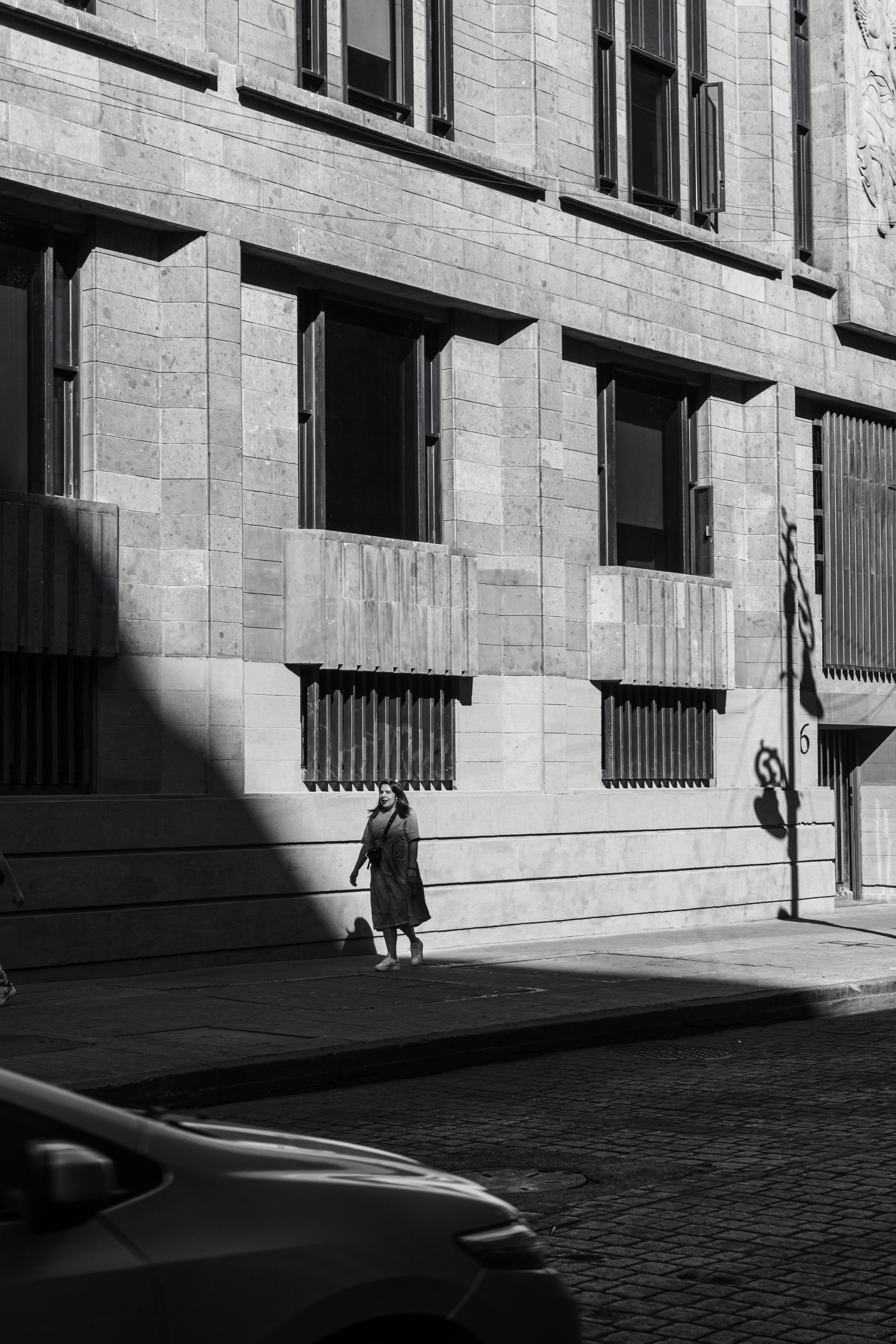 Black and White Urban Street Scene in Sunlight · Free Stock Photo
