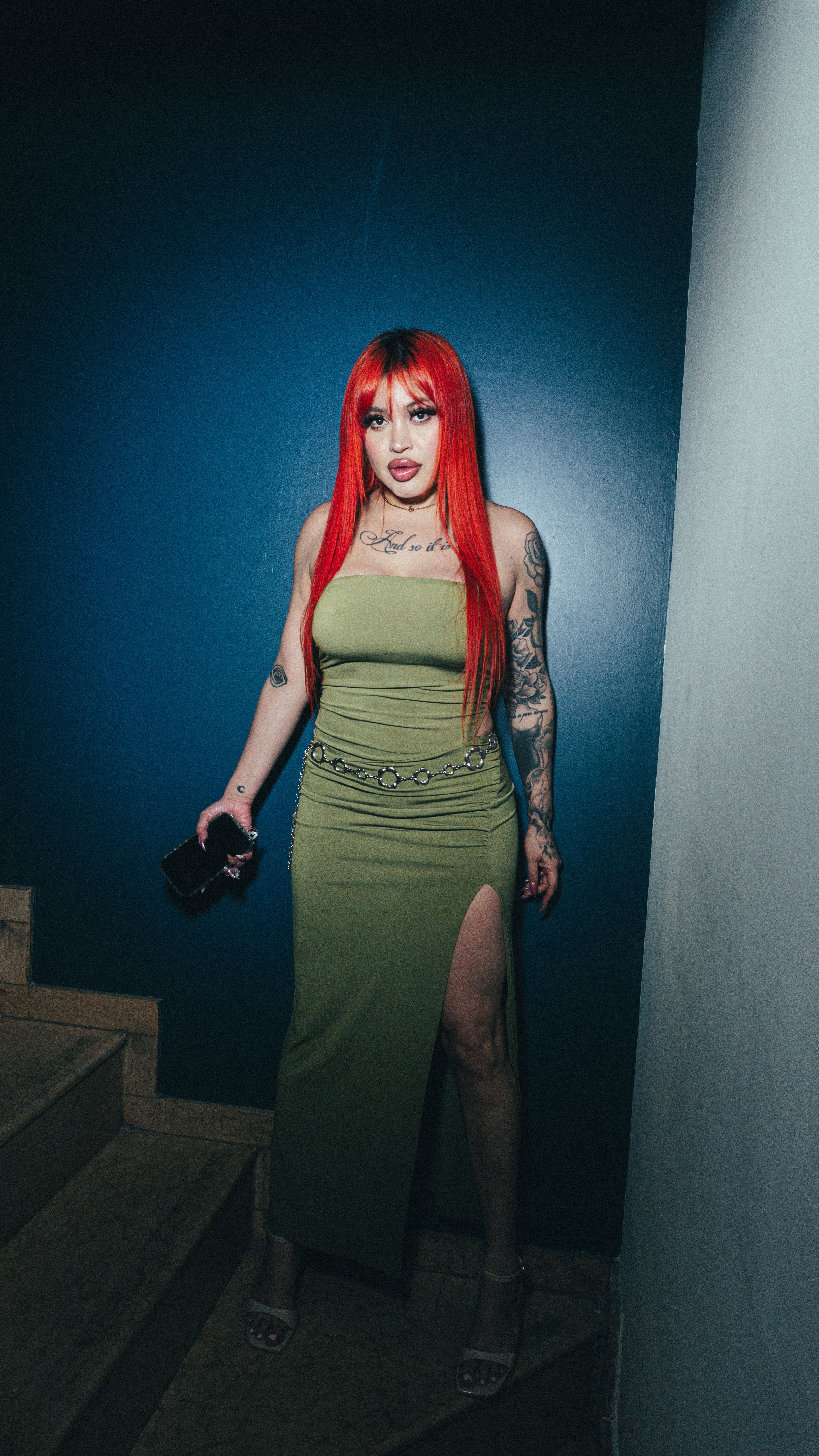 Fashionable Woman with Tattoos in Stylish Outfit