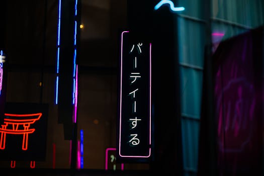Colorful neon signs illuminate the streets of Montréal, capturing a vibrant nightlife scene.