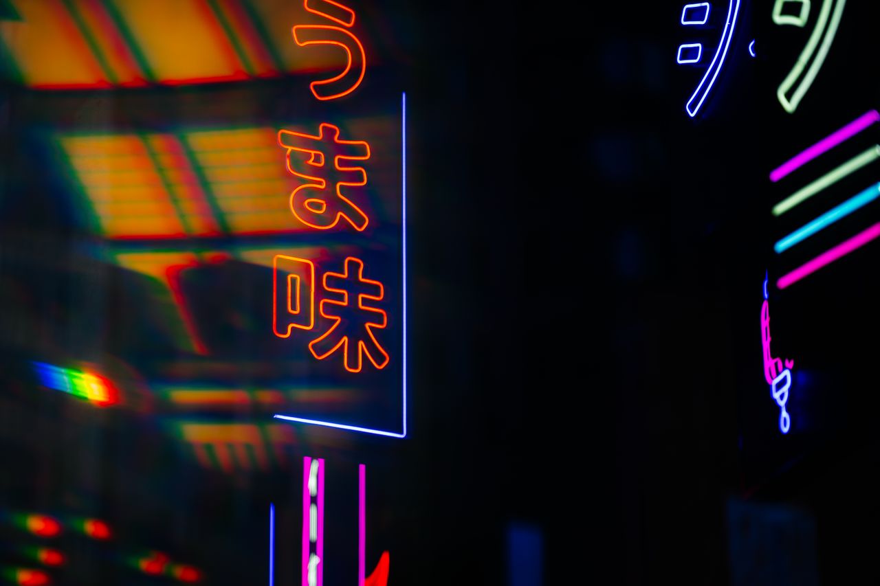 colorful neon lights illuminate the night with bold hues and striking