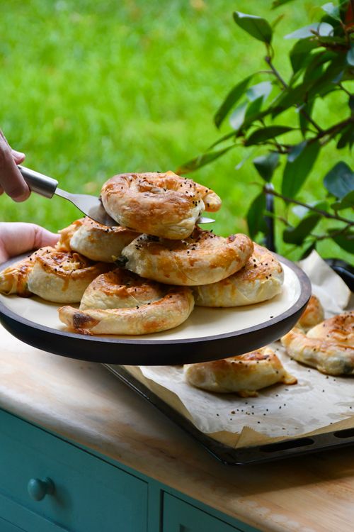 Free Plate of delicious homemade savory pastries outside on a sunny day. Stock Photo