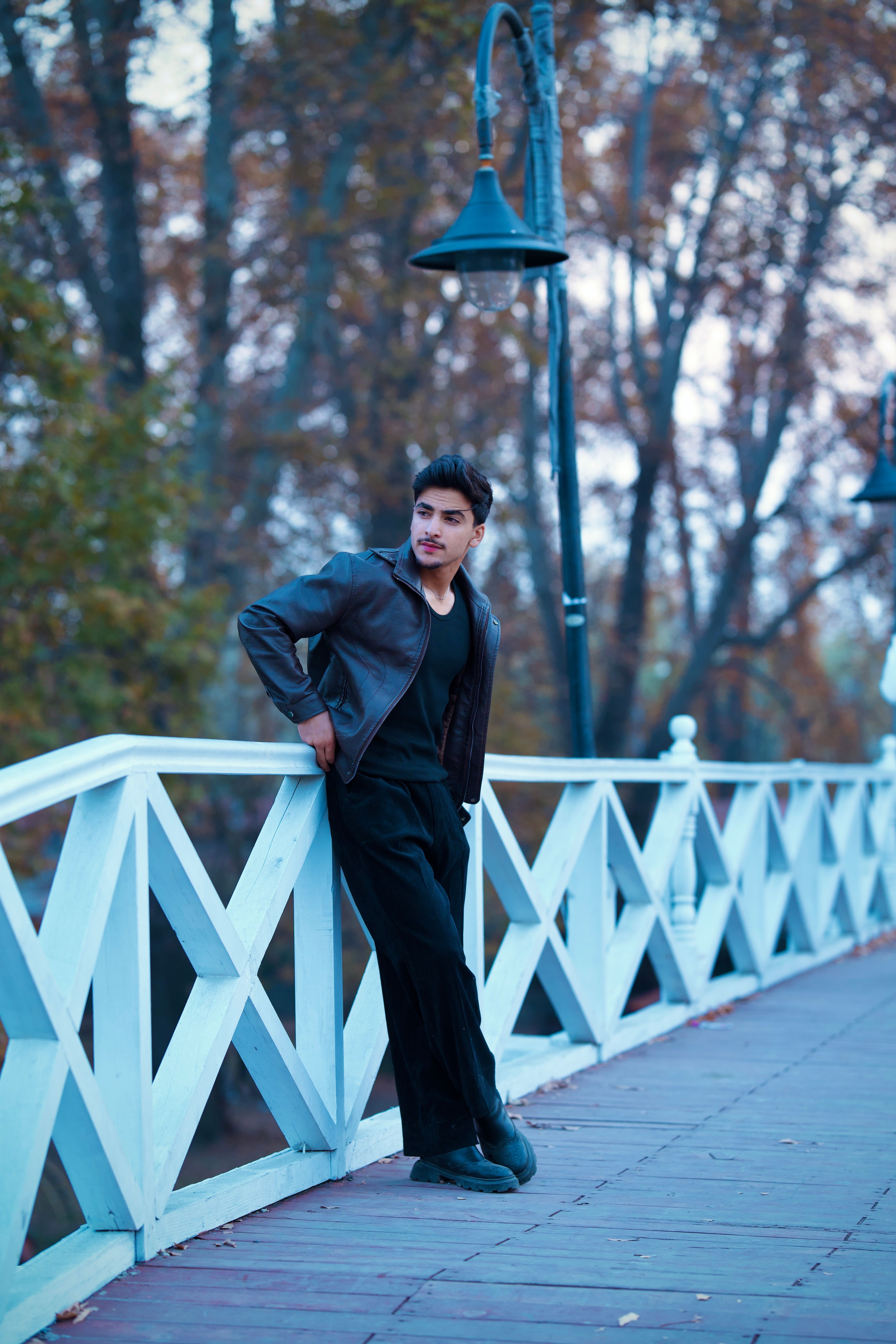 Stylish Man Posing on a Bridge in Srinagar · Free Stock Photo