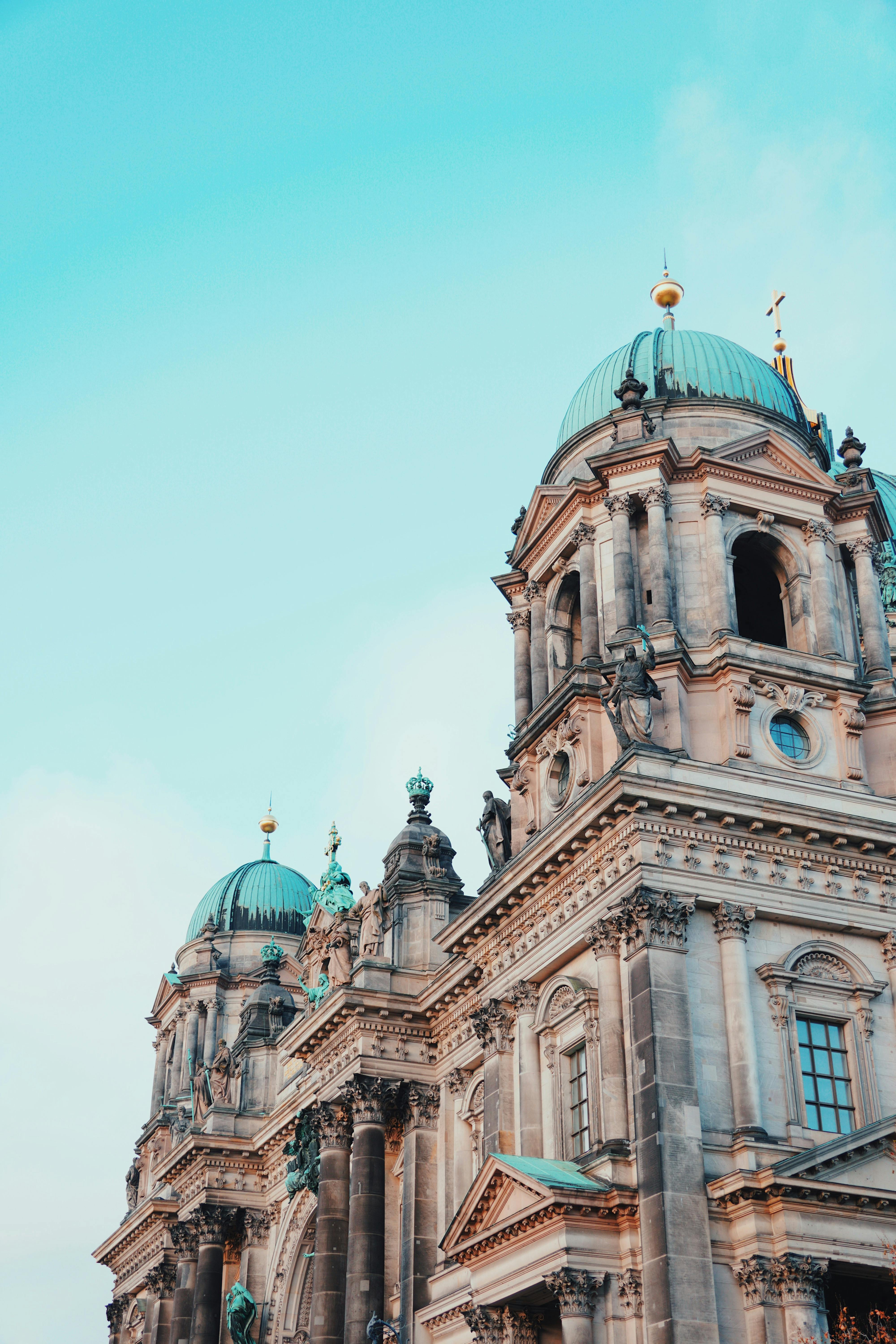 Captivating view of Berlin Cathedral's architecture against a clear winter sky, highlighting German design.