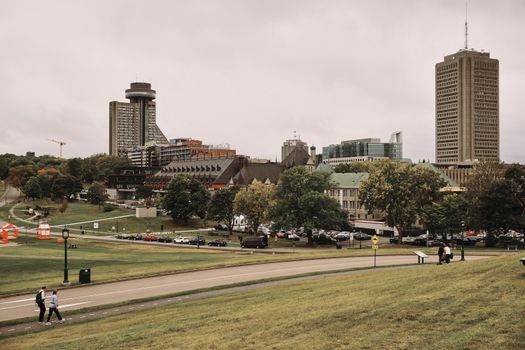 Panoramic view of Quebec City with towering buildings and leafy fall colors.