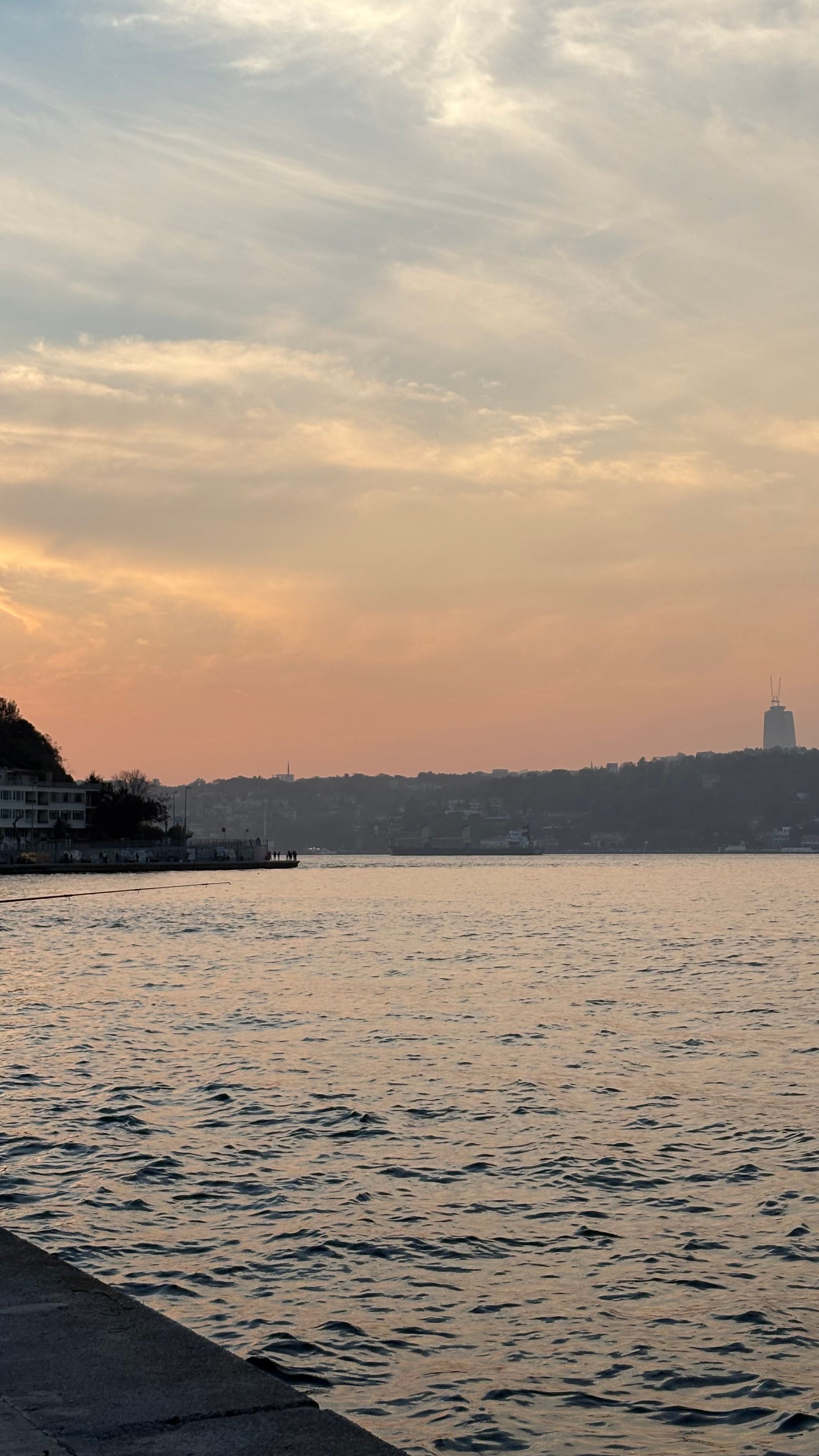 Sunset Over Serene Waterfront with Cityscape · Free Stock Photo