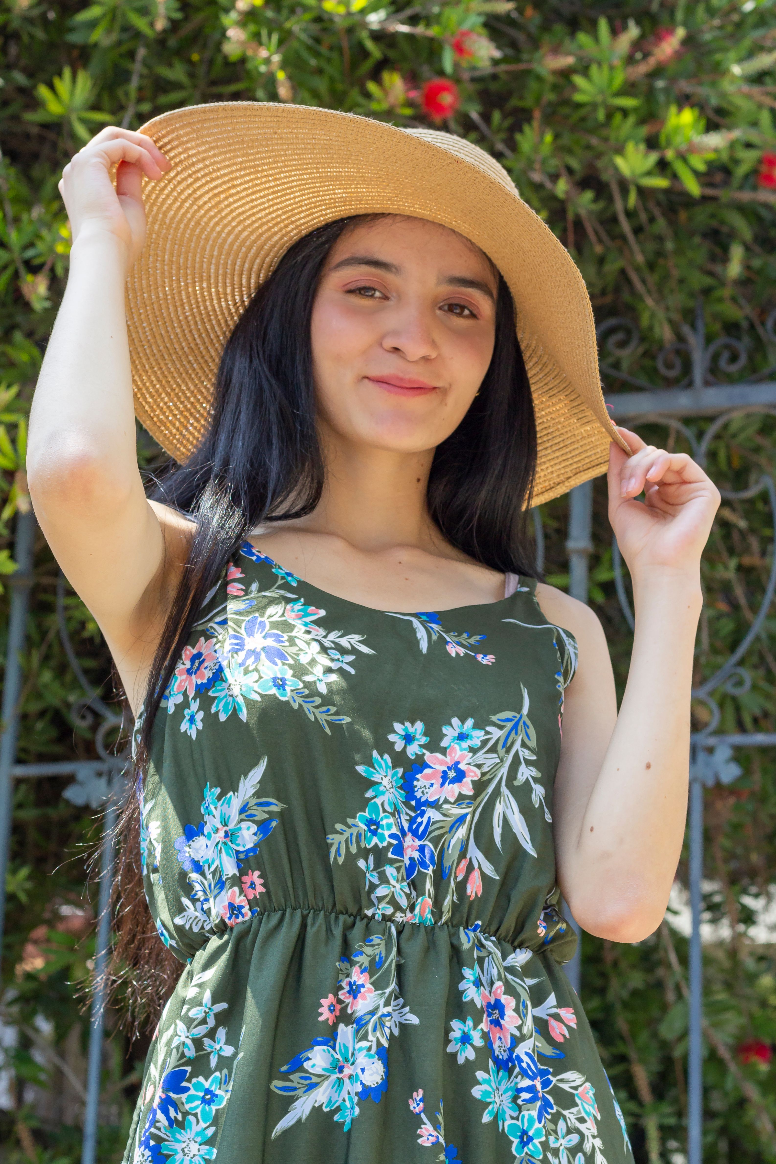 Young Woman in Floral Dress Enjoying Summer Outdoors · Free Stock Photo