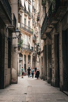 Stroll through a narrow, picturesque street in Barcelona, capturing the city's historic charm.