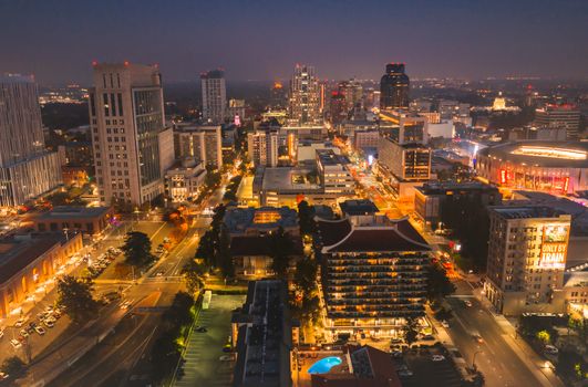 Stunning aerial shot of Sacramento city skyline illuminated at night, showcasing vibrant urban life.